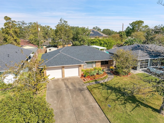 single story home with a garage and a front lawn