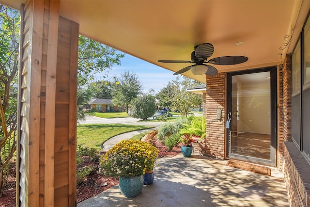 view of patio featuring ceiling fan