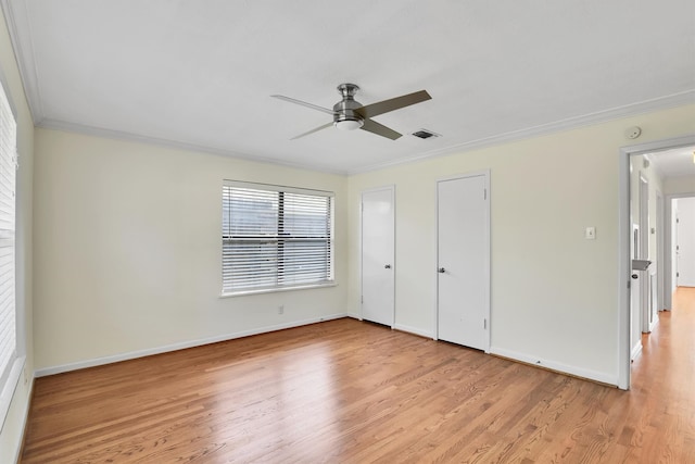 unfurnished bedroom with light hardwood / wood-style flooring, ceiling fan, and ornamental molding