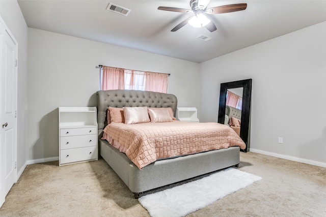 carpeted bedroom featuring a closet and ceiling fan