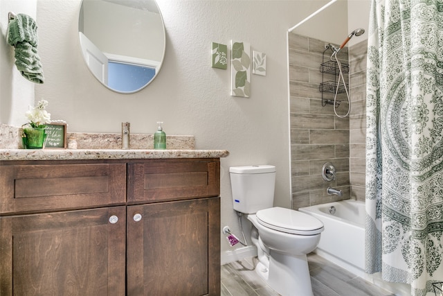 full bathroom with hardwood / wood-style floors, vanity, toilet, and shower / tub combo with curtain