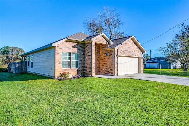 single story home featuring a garage and a front yard