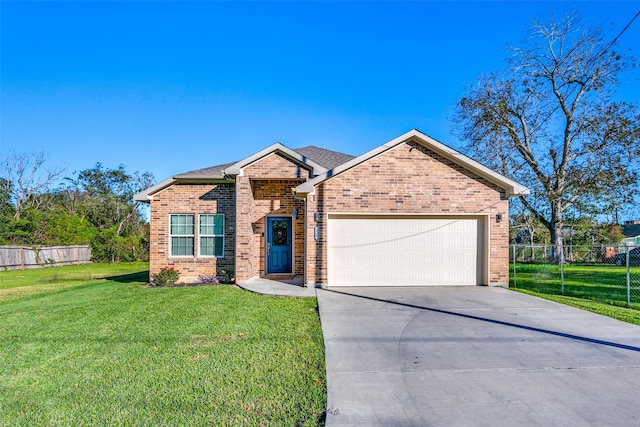 view of front of home with a garage and a front yard