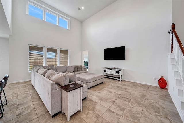 living room with a high ceiling