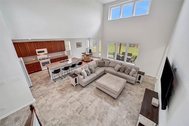 living room with a towering ceiling