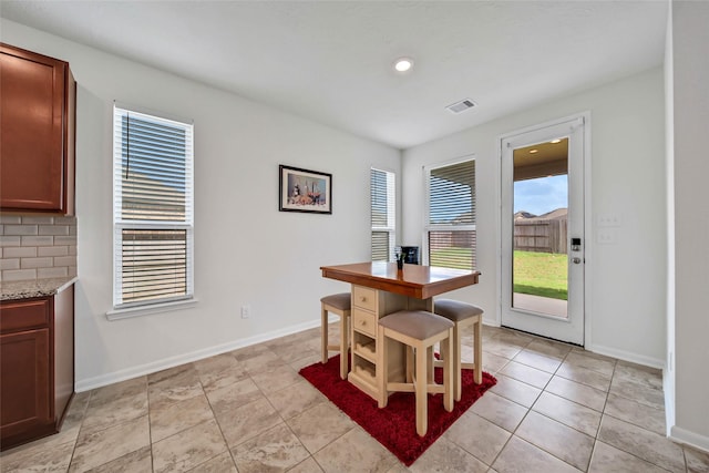 dining area with light tile patterned floors