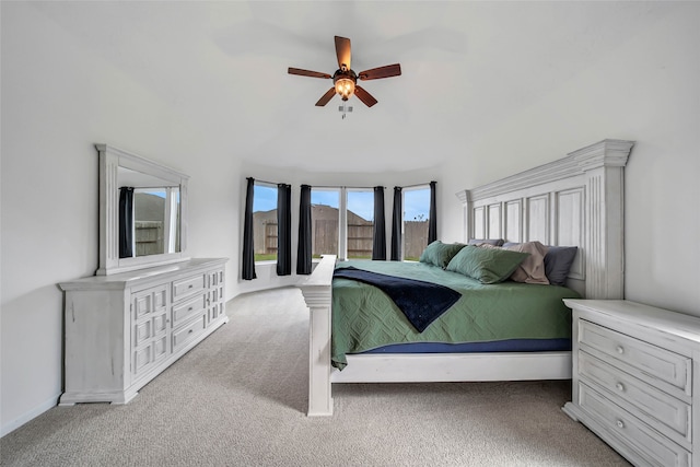 bedroom with ceiling fan and light carpet