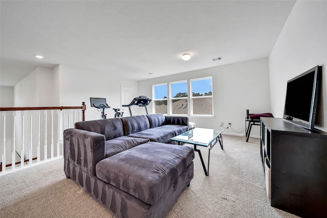 living room featuring light carpet