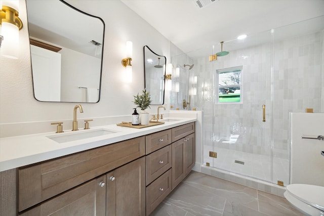 bathroom with vanity, toilet, and walk in shower