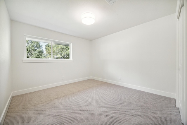 empty room with light colored carpet