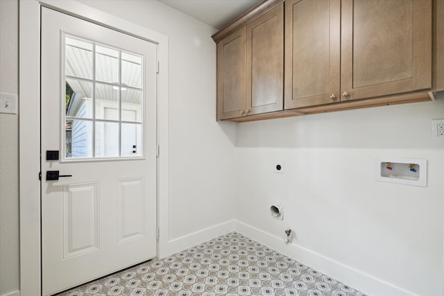 clothes washing area featuring washer hookup, cabinets, hookup for a gas dryer, and hookup for an electric dryer