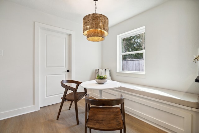 dining room with wood-type flooring