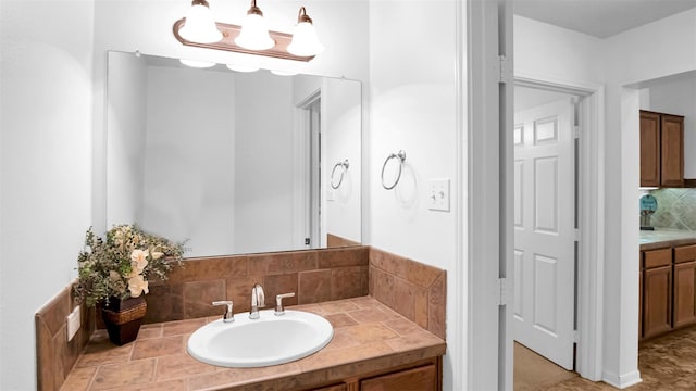 bathroom featuring tasteful backsplash and vanity