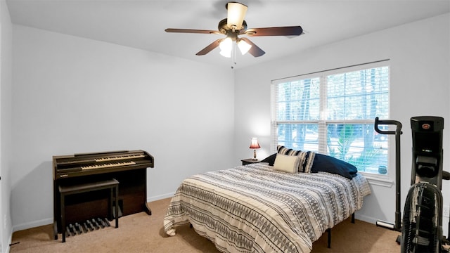 carpeted bedroom featuring ceiling fan and multiple windows