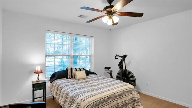 bedroom with ceiling fan and carpet floors