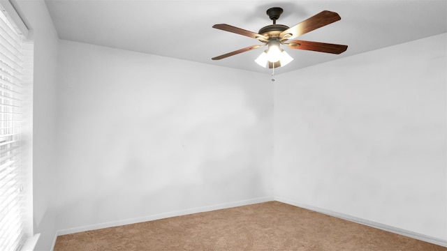 empty room featuring light colored carpet and a healthy amount of sunlight