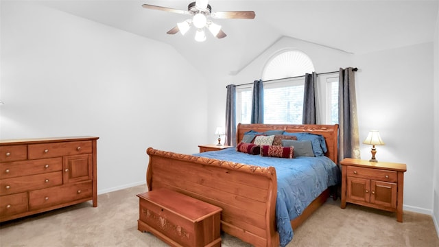 bedroom with ceiling fan, light colored carpet, and lofted ceiling