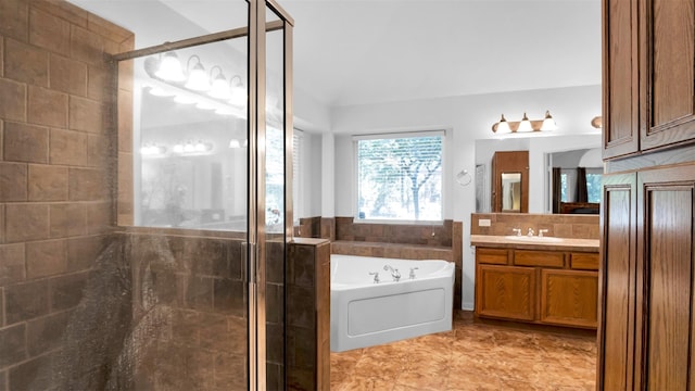 bathroom featuring tile patterned floors, vanity, and independent shower and bath