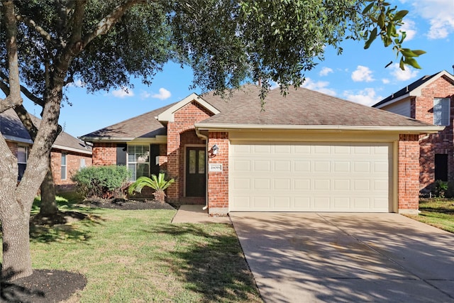 ranch-style house featuring a front yard and a garage