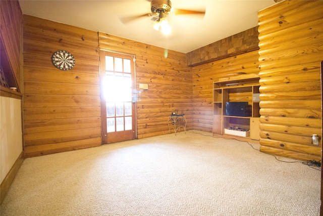 unfurnished living room with ceiling fan and carpet floors