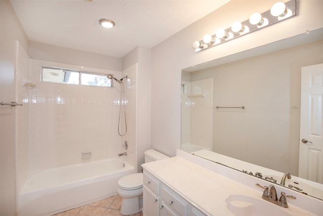 full bathroom featuring tile patterned floors, tiled shower / bath combo, toilet, and vanity