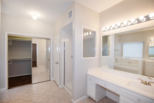 bathroom with vanity, tile patterned floors, and independent shower and bath