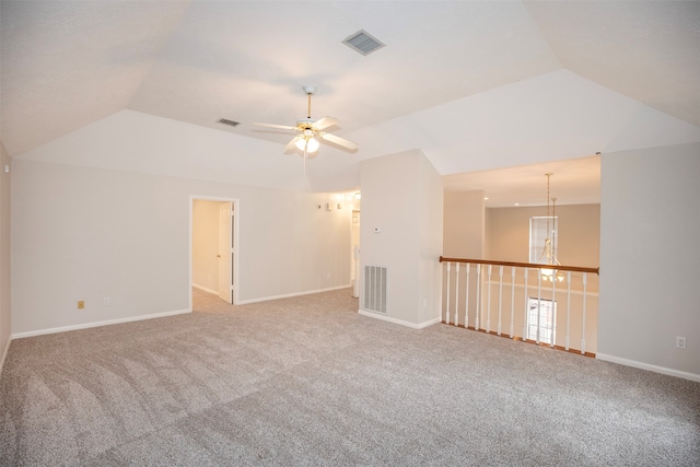 spare room featuring carpet flooring, ceiling fan, and lofted ceiling