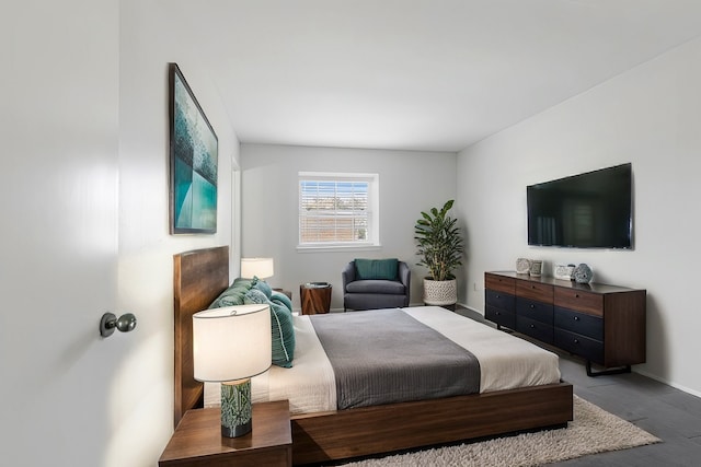 bedroom with hardwood / wood-style flooring