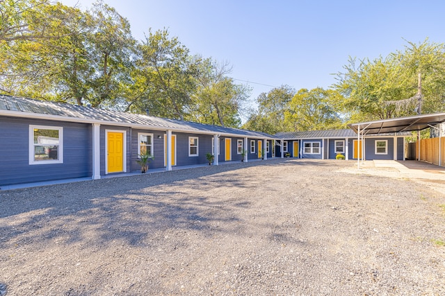 single story home featuring a carport