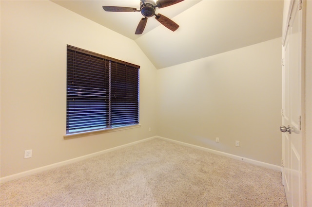 unfurnished room with ceiling fan, light colored carpet, and lofted ceiling