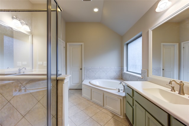 bathroom with tile patterned floors, plus walk in shower, vanity, and vaulted ceiling