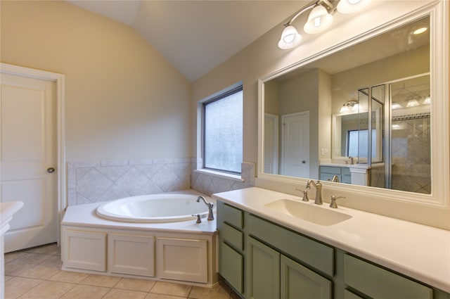 bathroom featuring tile patterned floors, vanity, vaulted ceiling, and separate shower and tub