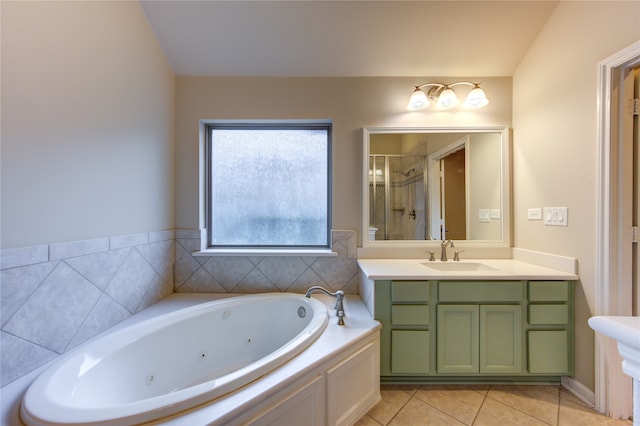 bathroom featuring tile patterned flooring, vanity, and separate shower and tub