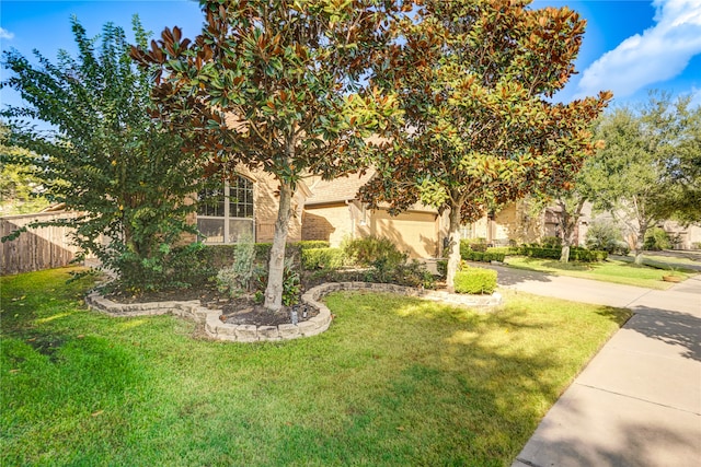 obstructed view of property featuring a front lawn