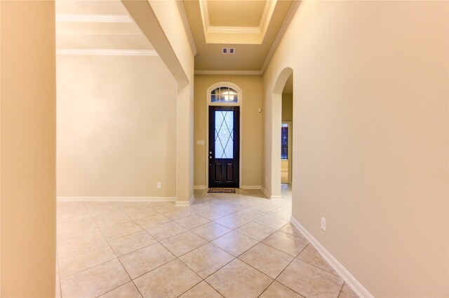 tiled foyer with ornamental molding