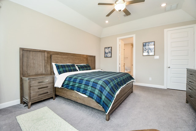 bedroom featuring ceiling fan, light colored carpet, and ensuite bathroom