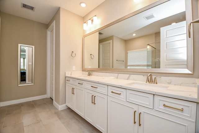 bathroom featuring tile patterned floors and vanity