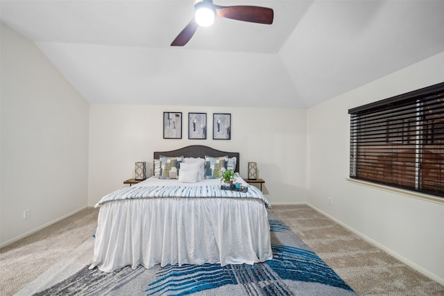 carpeted bedroom featuring vaulted ceiling and ceiling fan