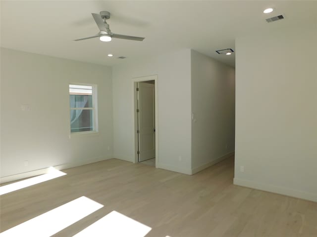 spare room with ceiling fan and light hardwood / wood-style flooring