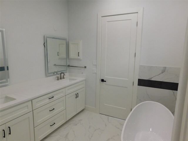 bathroom with vanity and a tub to relax in