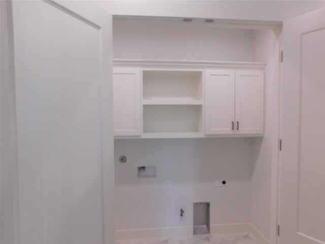 washroom with hookup for an electric dryer, hookup for a gas dryer, cabinets, and hookup for a washing machine