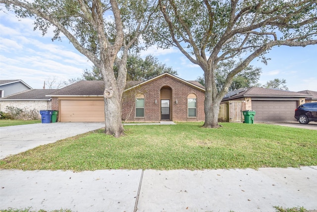 single story home featuring a front yard and a garage