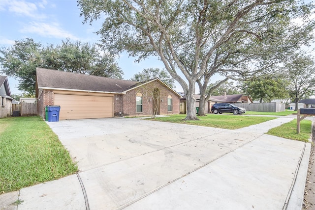 ranch-style house featuring a front yard and a garage