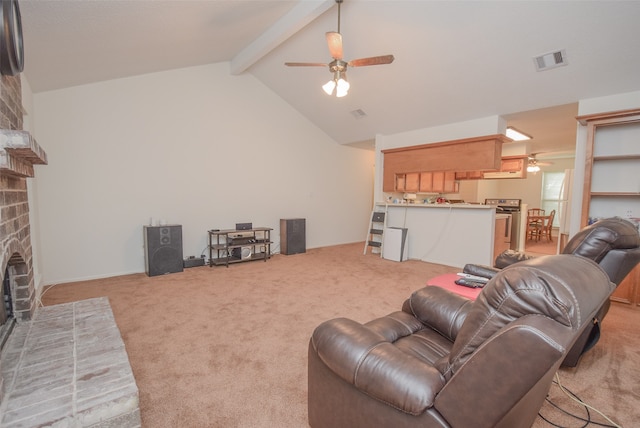 living room with lofted ceiling with beams, ceiling fan, light colored carpet, and a fireplace