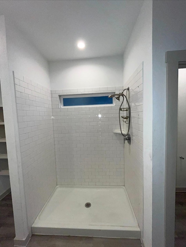 bathroom with a tile shower