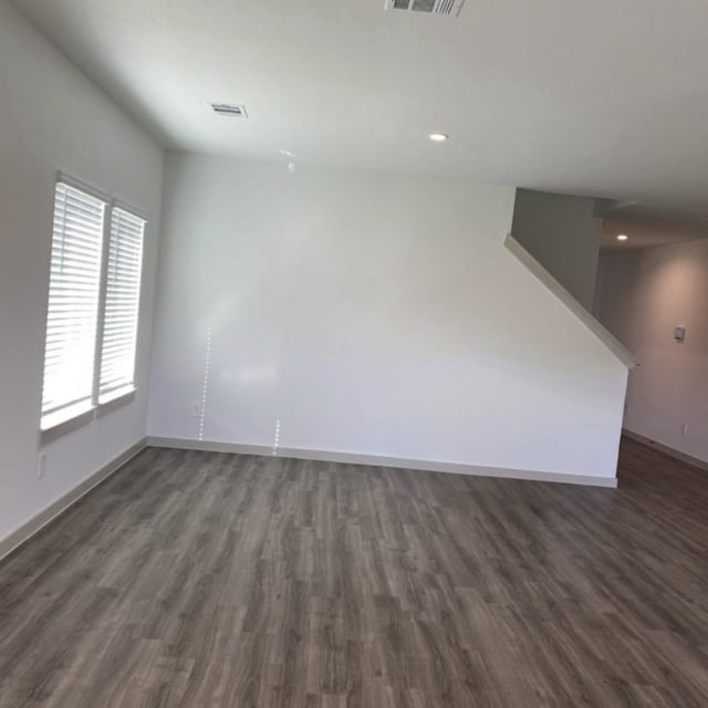 empty room with dark hardwood / wood-style floors