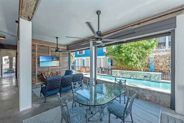 view of patio featuring pool water feature and ceiling fan