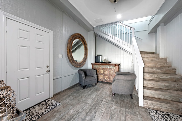 entryway with hardwood / wood-style flooring