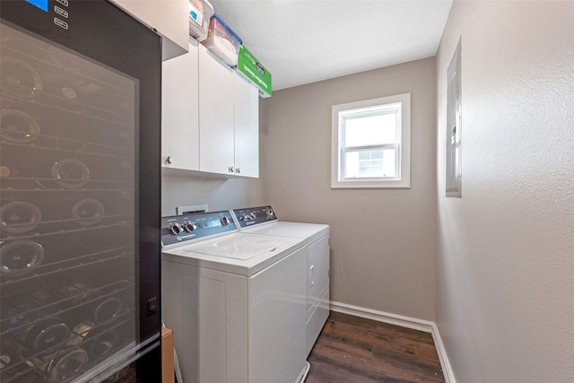 151 Bamaku Bnd, Tiki Island, TX 77554 - laundry area featuring washer and dryer, dark wood finished floors, baseboards, and cabinet space