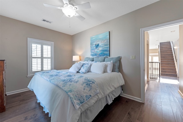 bedroom featuring ceiling fan and dark wood-type flooring